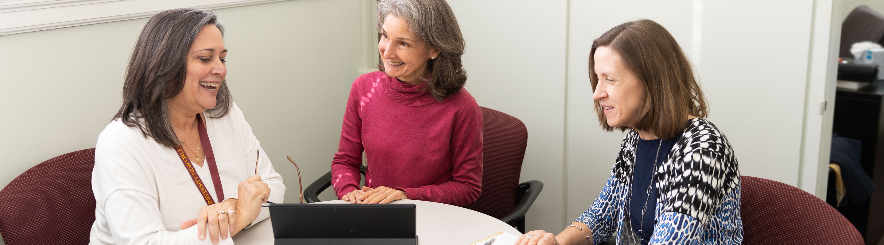 Three Professors Discussing Online Courses